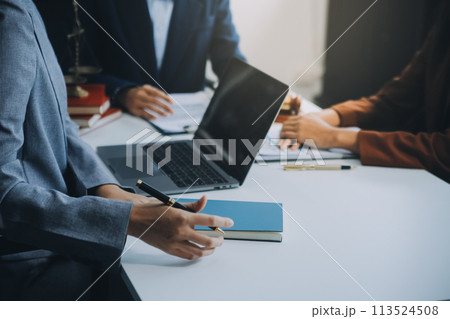 Businessman and lawyer discuss the contract document. Treaty of the law. Sign a contract business. Businessman and lawyer discuss the contract document. Treaty of the law. Sign a contract business. 113524508