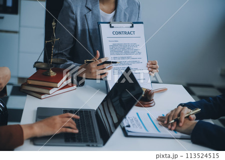 Businessman and lawyer discuss the contract document. Treaty of the law. Sign a contract business. Businessman and lawyer discuss the contract document. Treaty of the law. Sign a contract business. 113524515