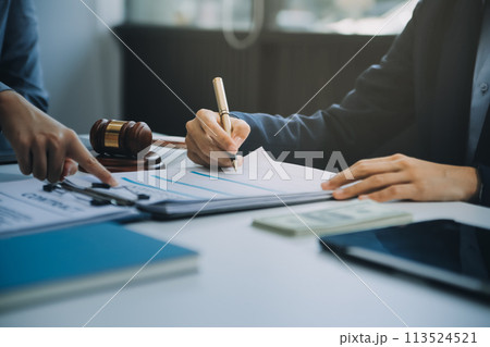 Businessman and lawyer discuss the contract document. Treaty of the law. Sign a contract business. 113524521