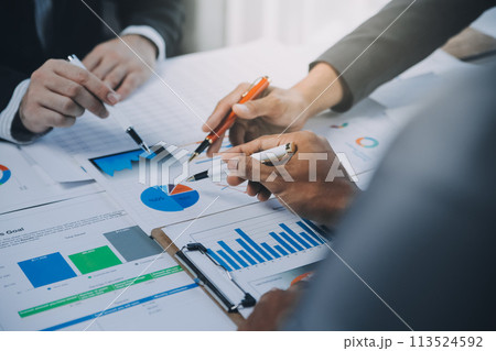 Business idea. Business people talking And calculations about charts and graphs showing the growth of investment results Of successful teamwork Business idea. Business people talking And calculations about charts and graphs showing the growth of investment results Of successful teamwork 113524592