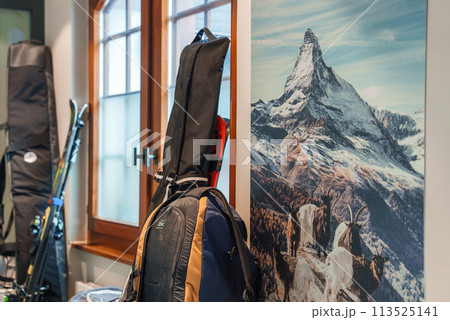 Luxury hotel room in Zermatt with winter sports gear and iconic Matterhorn print. Warm ambiance and alpine wildlife elements. Perfect for ski enthusiasts. Luxury hotel room in Zermatt with winter sports gear and iconic Matterhorn print. Warm ambiance and alpine wildlife elements. Perfect for ski enthusiasts. 113525141