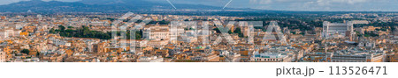 An aerial panorama of Rome shows terracotta rooftops and green canopies, blending ancient and modern architecture. An aerial panorama of Rome shows terracotta rooftops and green canopies, blending ancient and modern architecture. 113526471