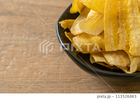 Banana Chips - fried or baked sliced banana Banana Chips - fried or baked sliced banana 113526863