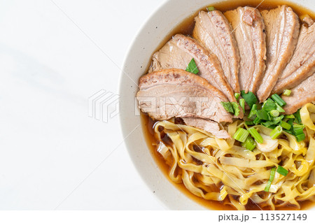 egg noodles with stewed duck in brown soup egg noodles with stewed duck in brown soup 113527149