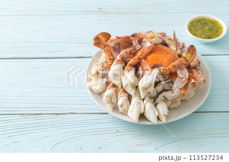 Steamed blue crab with spicy seafood sauce Steamed blue crab with spicy seafood sauce 113527234