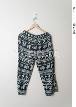 trousers or long pants hanging on wall 113527838