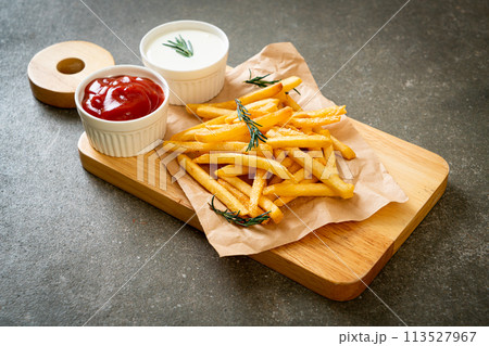 French fries with sour cream and ketchup 113527967