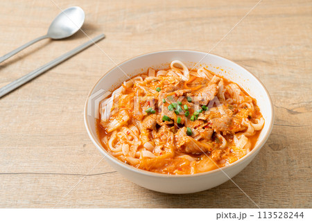 Korean udon ramen noodles with pork in kimchi soup 113528244