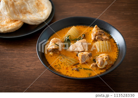 Chicken curry soup with roti Chicken curry soup with roti 113528330