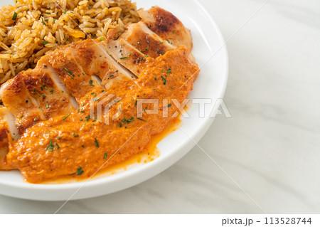 grilled chicken steak with red curry sauce and rice 113528744