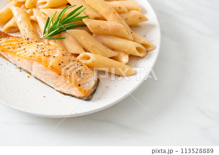 salmon with penne pasta cream sauce salmon with penne pasta cream sauce 113528889