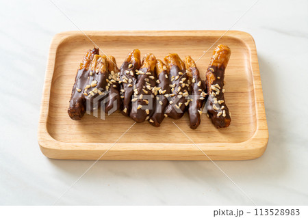 banana chocolate coating or banana dipped chocolate banana chocolate coating or banana dipped chocolate 113528983