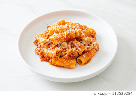 Rigatoni pasta bolognese with cheese Rigatoni pasta bolognese with cheese 113529284
