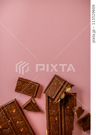 Chocolate bar pieces. Background with chocolate. Sweet food photo concept. 113529609
