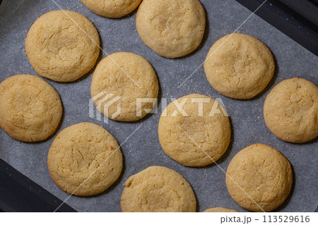Delicious sugar cookies on wooden table, closeup Delicious sugar cookies on wooden table, closeup 113529616