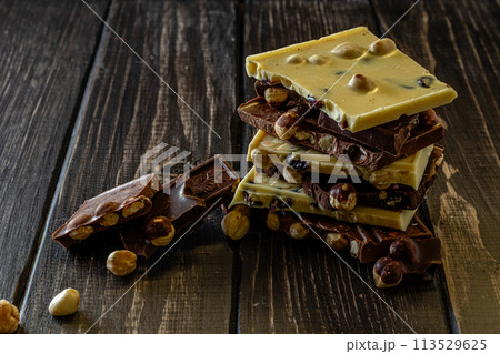 Chocolate bar pieces. Background with chocolate. Sweet food photo concept. Chocolate bar pieces. Background with chocolate. Sweet food photo concept. 113529625