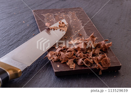 Chocolate bar pieces. Background with chocolate. Sweet food photo concept. 113529639