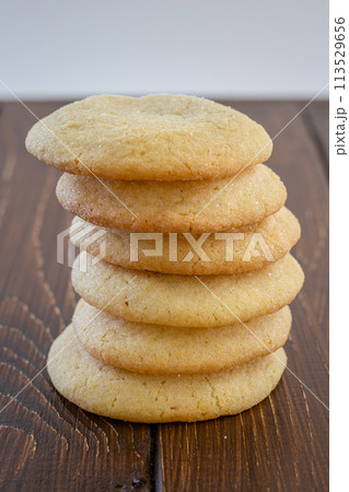 Delicious sugar cookies on wooden table, closeup Delicious sugar cookies on wooden table, closeup 113529656