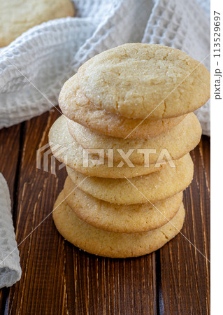 Delicious sugar cookies on wooden table, closeup 113529697