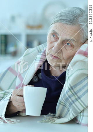 Close up portrait of a sick senior woman 113532313