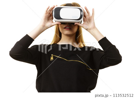 Woman wearing VR goggles 113532512