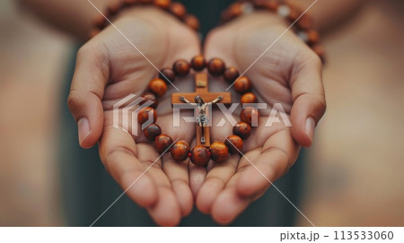 Soulful prayer: a man in quiet devotion, hands clasped around a rosary cross, seeking solace and spiritual connection, capturing the essence of serene contemplation, faith, and religious devotion. Soulful prayer: a man in quiet devotion, hands clasped around a rosary cross, seeking solace and spiritual connection, capturing the essence of serene contemplation, faith, and religious devotion. 113533060