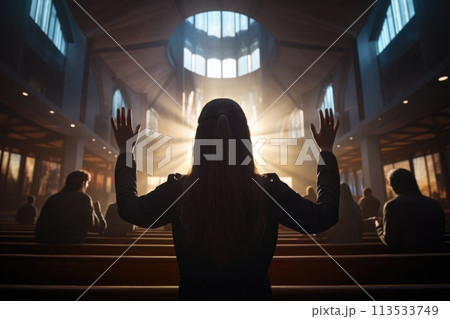 Capturing divine moments: church worship concept Christians, raised hands, earnestly pray and worship to cross in the sacred ambiance of a church building, expressing faith and spiritual connection. 113533749
