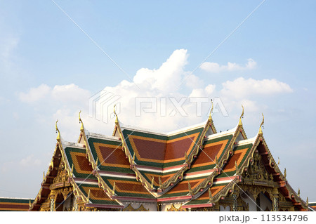 Roof of Thai temple with blue sky And cloudy. Thai style roof of Buddhist temple with blue sky. 113534796