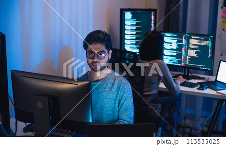 asian and Indian Developer  devops team working  about coding promgram with software computer at night in office 113535025