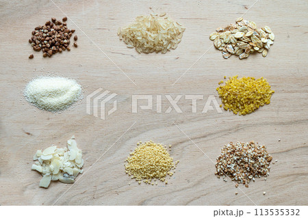 Assorted cereal grain porridge seeds set on a wooden background 113535332