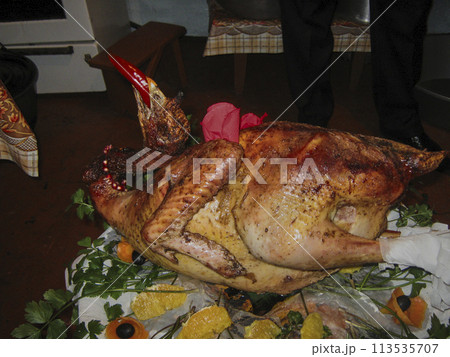 Holiday Roast Turkey.Beautifully decorated turkey with red pepper in its beak. 113535707