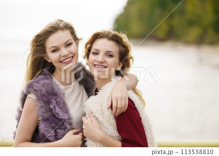 Two fashionable women outdoor Two fashionable women outdoor 113538810