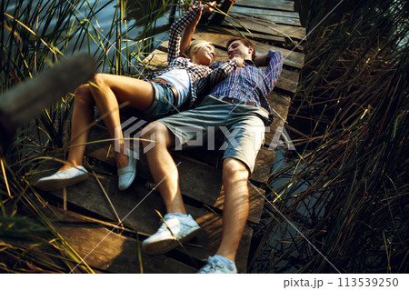 Couple in love enjoying tender moments during sunset . Emotional concept of relationship. 113539250