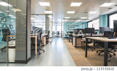 Interior of bright creative workspace with computer desks 113539820
