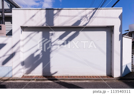 A closeup shot of automatic metal roller door used in factory, storage, garage, and industrial warehouse. The corrugated and foldable metal sheet offer space saving and provide urban and rustic feel 113540311