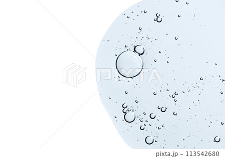 The texture of a body serum or cosmetic oil with bubbles. Liquid skin care product. Copy space. 113542680