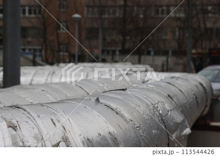 The main provides the city with hot water. Selective focus. The large pipes 113544426