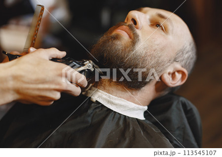 Man with a beard. Hairdresser with a client. Man with a shave. Man with a beard. Hairdresser with a client. Man with a shave. 113545107