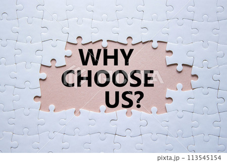 Why choose us symbol. Concept words Why choose us on white puzzle. Beautiful pink background. Business and Why choose us concept. Copy space. 113545154