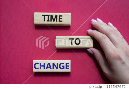 Time to change symbol. Concept word Time to change on wooden blocks. Businessman hand. Beautiful red background. Business and Time to change concept. Copy space Time to change symbol. Concept word Time to change on wooden blocks. Businessman hand. Beautiful red background. Business and Time to change concept. Copy space 113547672