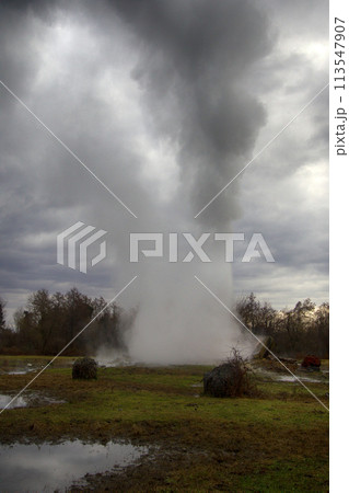 Steam over hot spring Steam over hot spring 113547907