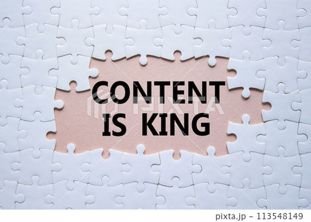 Content is king symbol. Concept words Content is king on white puzzle. Beautiful pink background. Business and Content is king concept. Copy space. 113548149