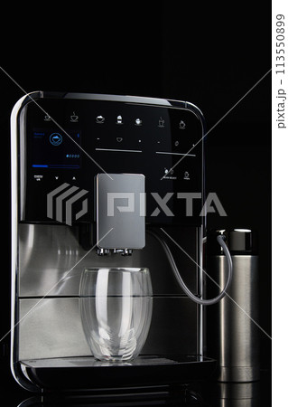 Coffee Machine With Glass Cup Against Dark Background Coffee Machine With Glass Cup Against Dark Background 113550899