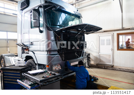Truck repair service indoors. Maintenance workshop. 113551417