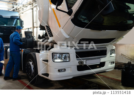 Truck repair service indoors. Maintenance workshop. 113551418