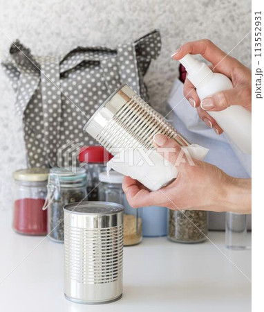 person disinfecting surface 113552931