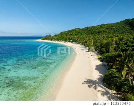 Beautiful white sand beach and crystal clear water. Cobrador Island. Romblon, Philippines. Beautiful white sand beach and crystal clear water. Cobrador Island. Romblon, Philippines. 113553476