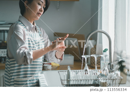 a forty-something woman a forty-something woman 113556334