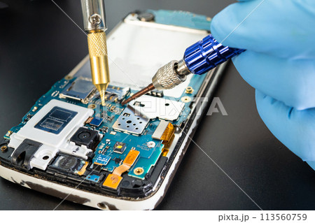 Repairing and upgrade Samsung mobile phone, electronic, computer hardware and technology concept. 113560759