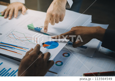 Business idea. Business people talking And calculations about charts and graphs showing the growth of investment results Of successful teamwork 113564549